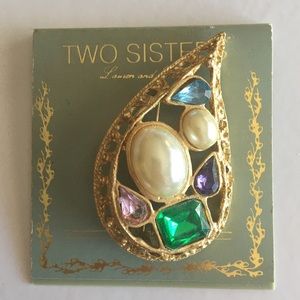 Gold tone Tear drop brooch with multi colored crystals